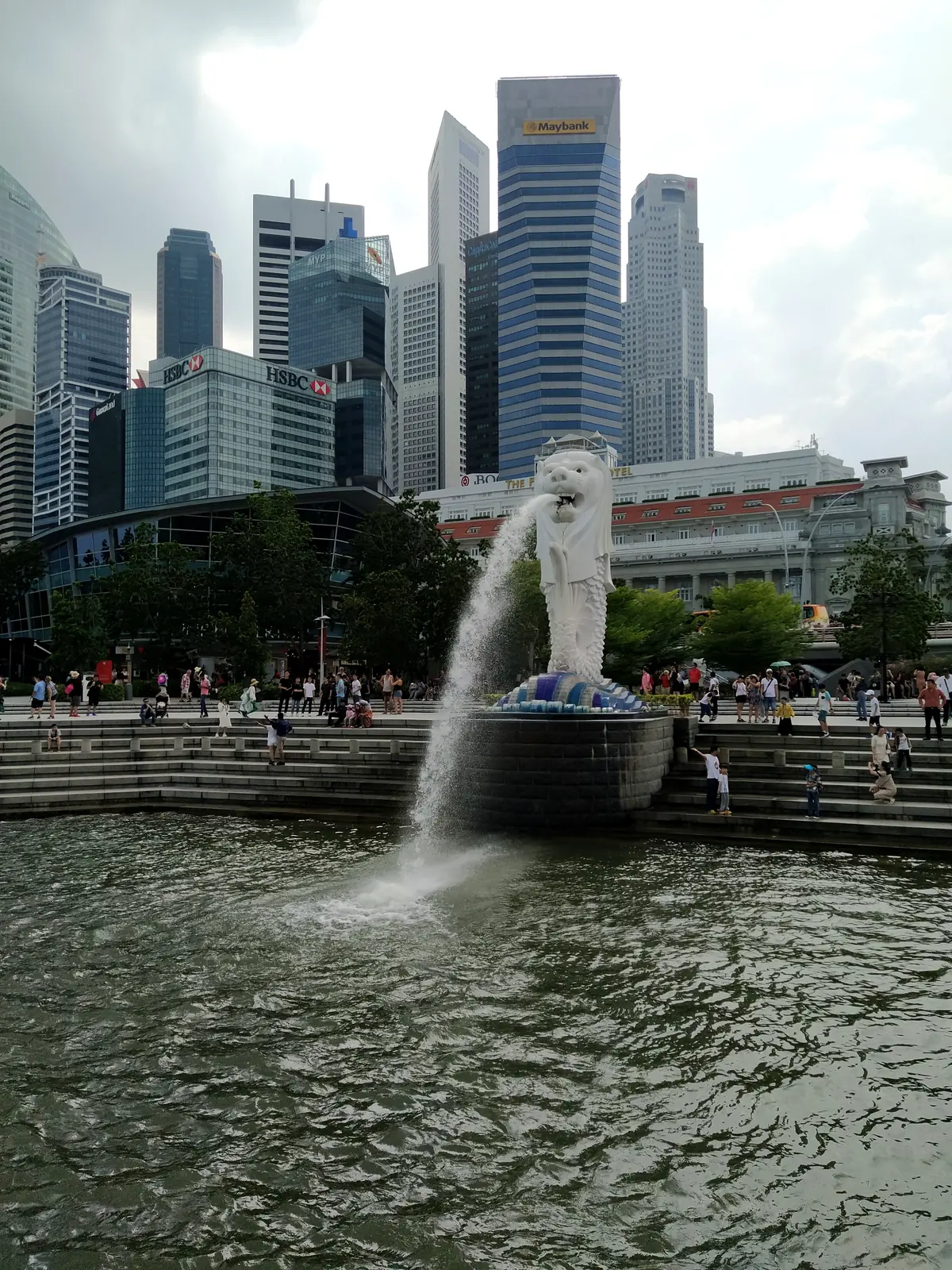 The Merlion statue and Singapore's downtown skyline — photographed by the goFLY team in Singapore