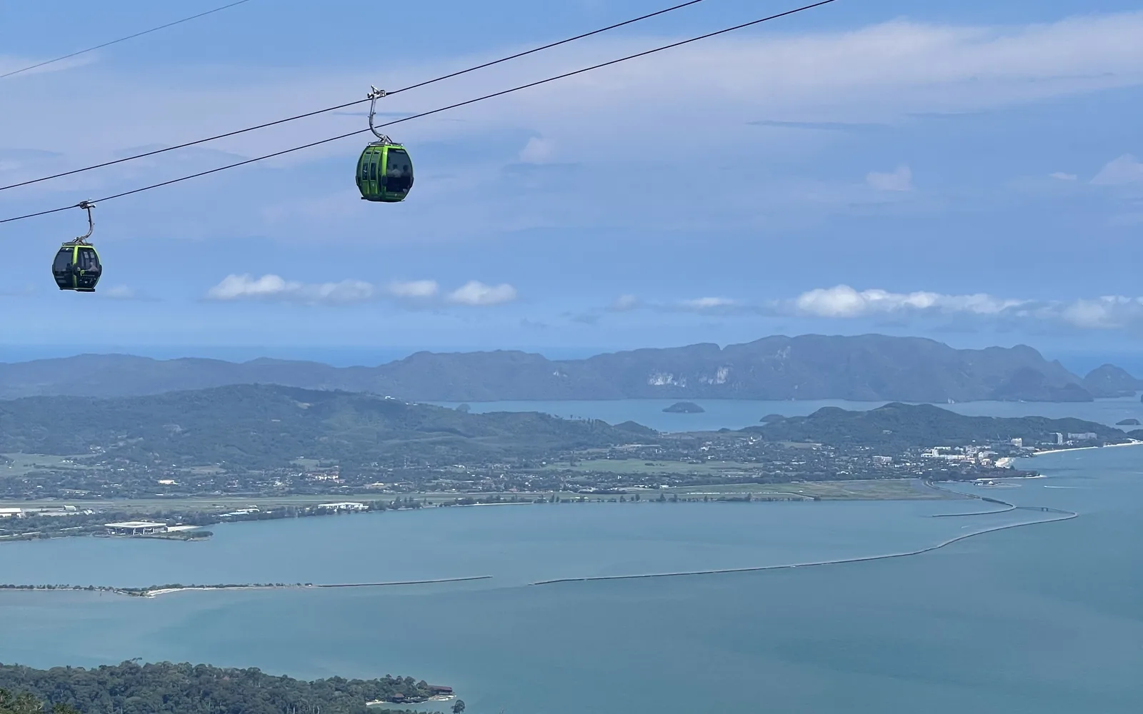 Cable-car gondolas climbing above the Langkawi coast and sea, Malaysia — photo by goFLY founder Mahabub Alam Razu, August 2024