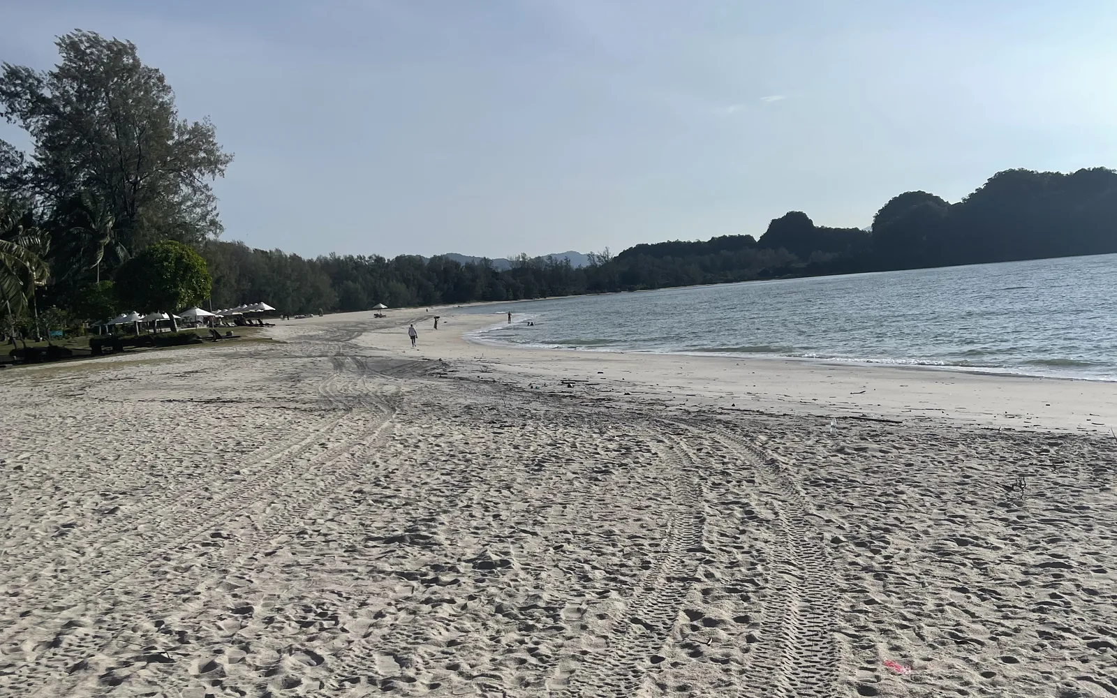 The wide sandy sweep of Pantai Cenang beach in Langkawi, Malaysia — photo by goFLY founder Mahabub Alam Razu, August 2024