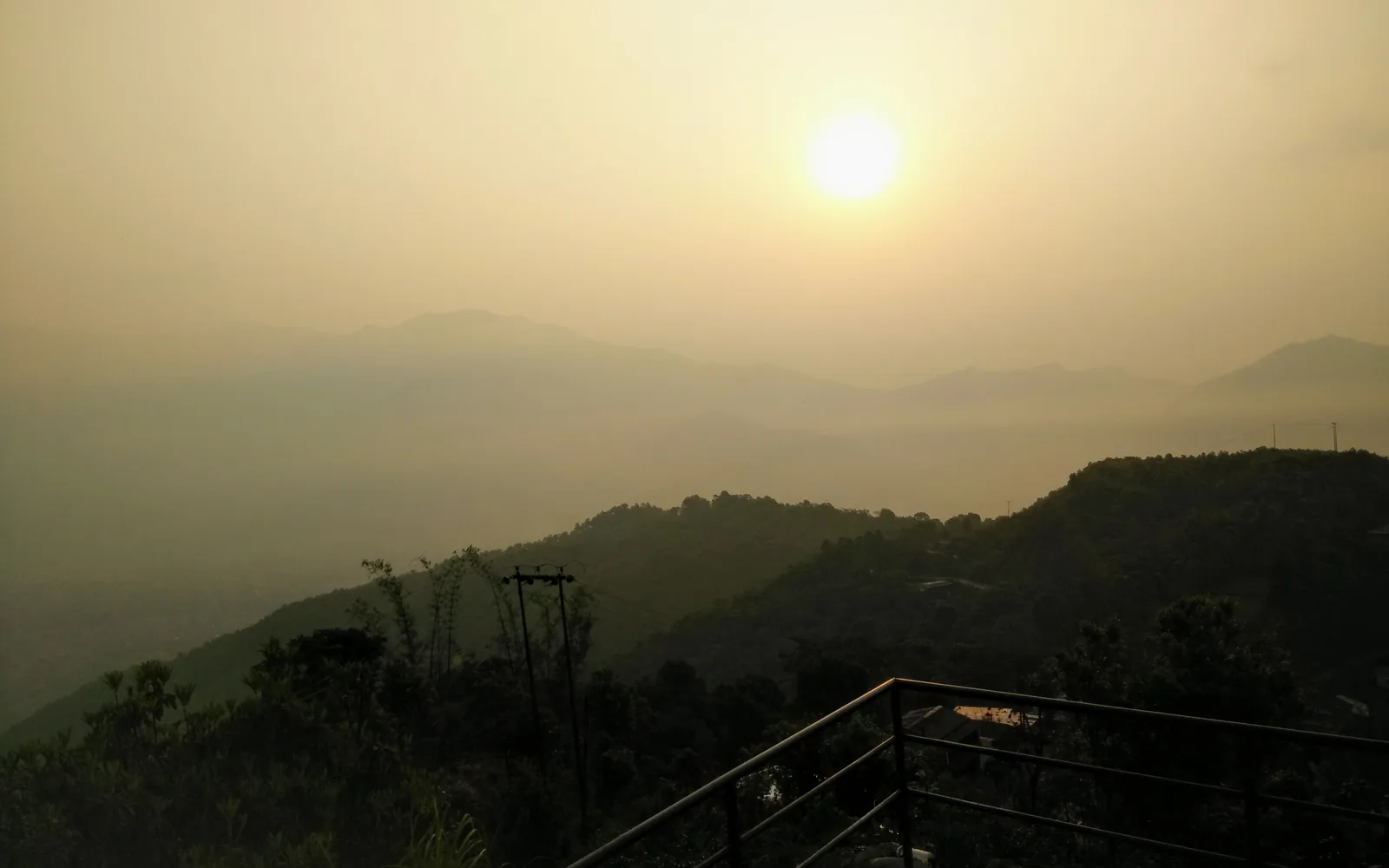 Sunrise over misty hills above Pokhara, Nepal