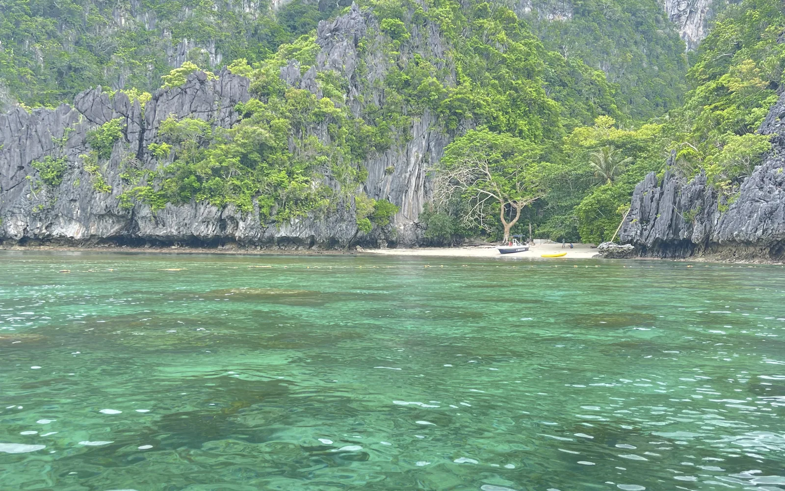 Turquoise water and limestone cliffs at El Nido's Big Lagoon, Palawan, Philippines — photo by goFLY founder Mahabub Alam Razu