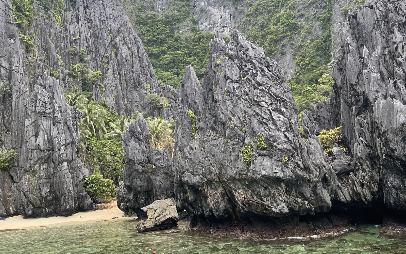 Limestone cliffs rising over a lagoon explored by kayak in El Nido, Palawan, Philippines — photo by goFLY founder Mahabub Alam Razu, August 2024