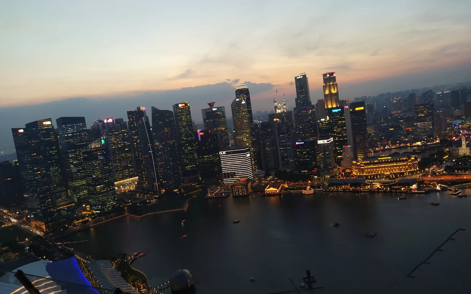 Aerial view of the Singapore skyline and Marina Bay at dusk from the Marina Bay Sands SkyPark — photo by goFLY founder Mahabub Alam Razu, January 2020