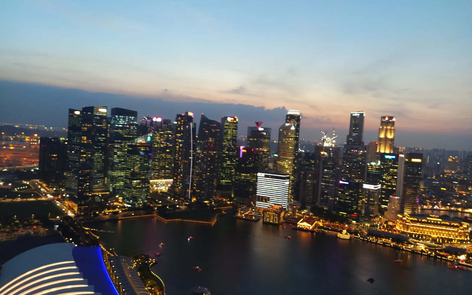 The Singapore skyline lit at night from the Marina Bay Sands SkyPark — photo by goFLY founder Mahabub Alam Razu, January 2020