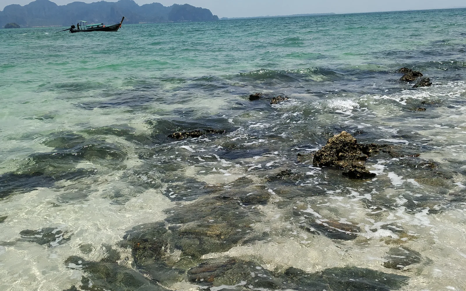 Crystal-clear turquoise shallows over rocks near the Krabi islands, Thailand — photo by goFLY founder Mahabub Alam Razu, March 2019