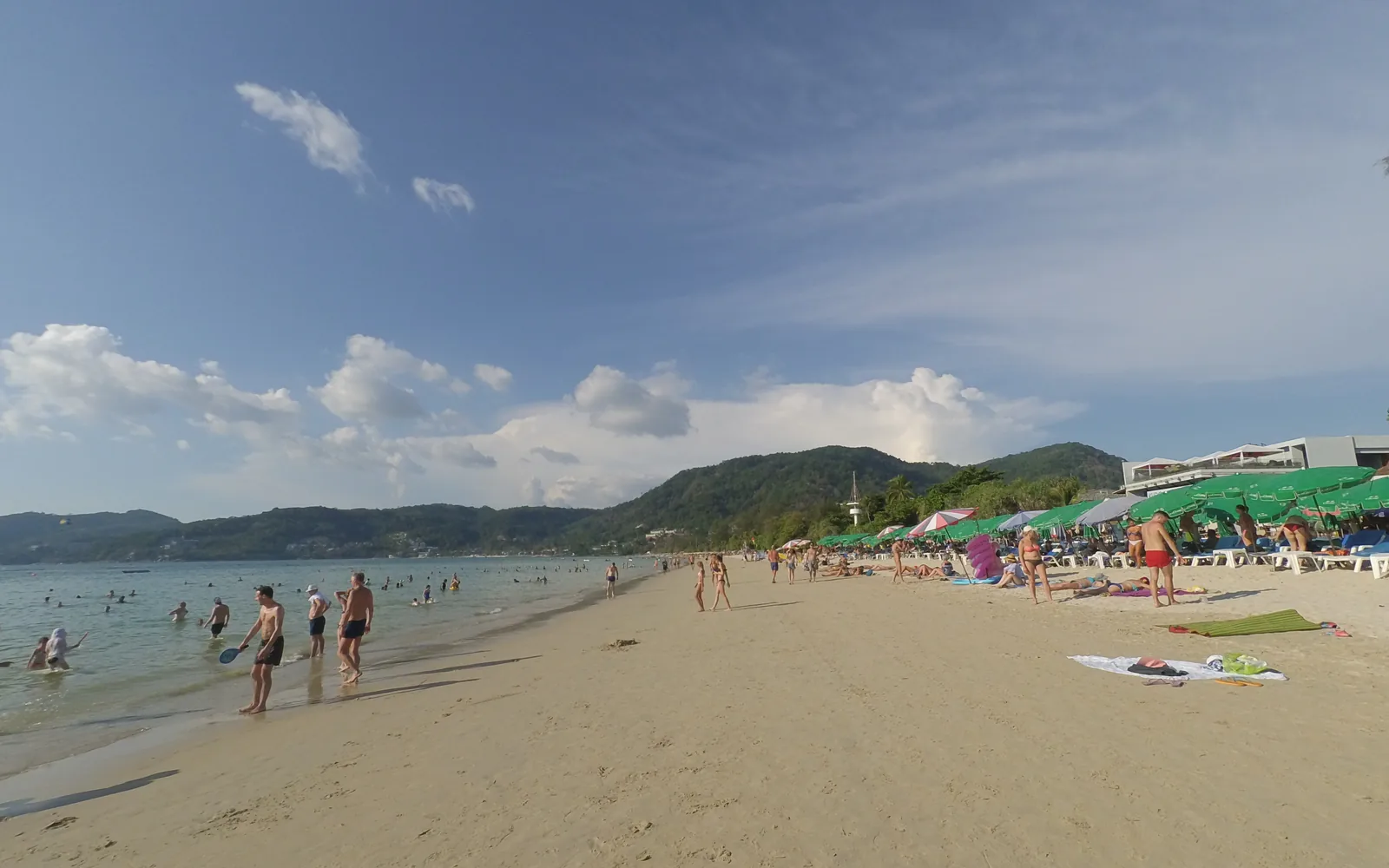 Patong Beach on a clear day with green hills behind, Phuket, Thailand — photo by goFLY founder Mahabub Alam Razu, March 2019
