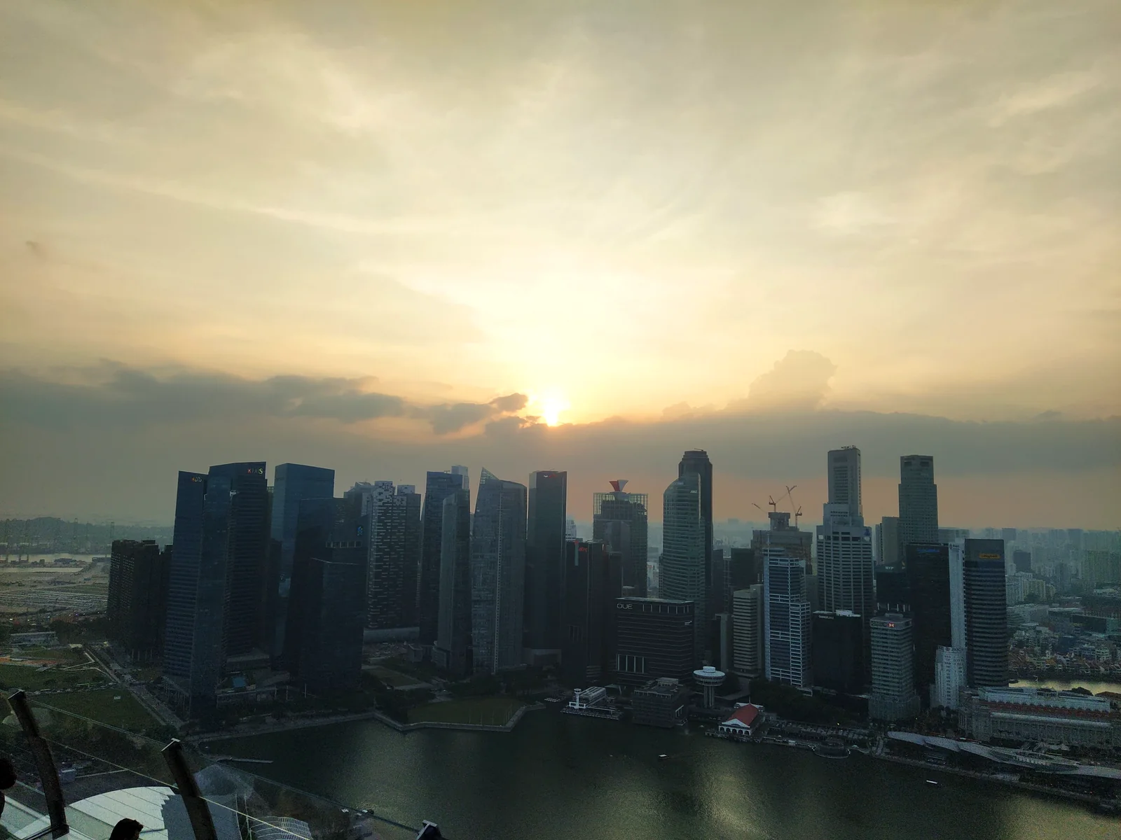 Singapore's downtown skyline at sunset over Marina Bay — photographed by the goFLY team in Singapore