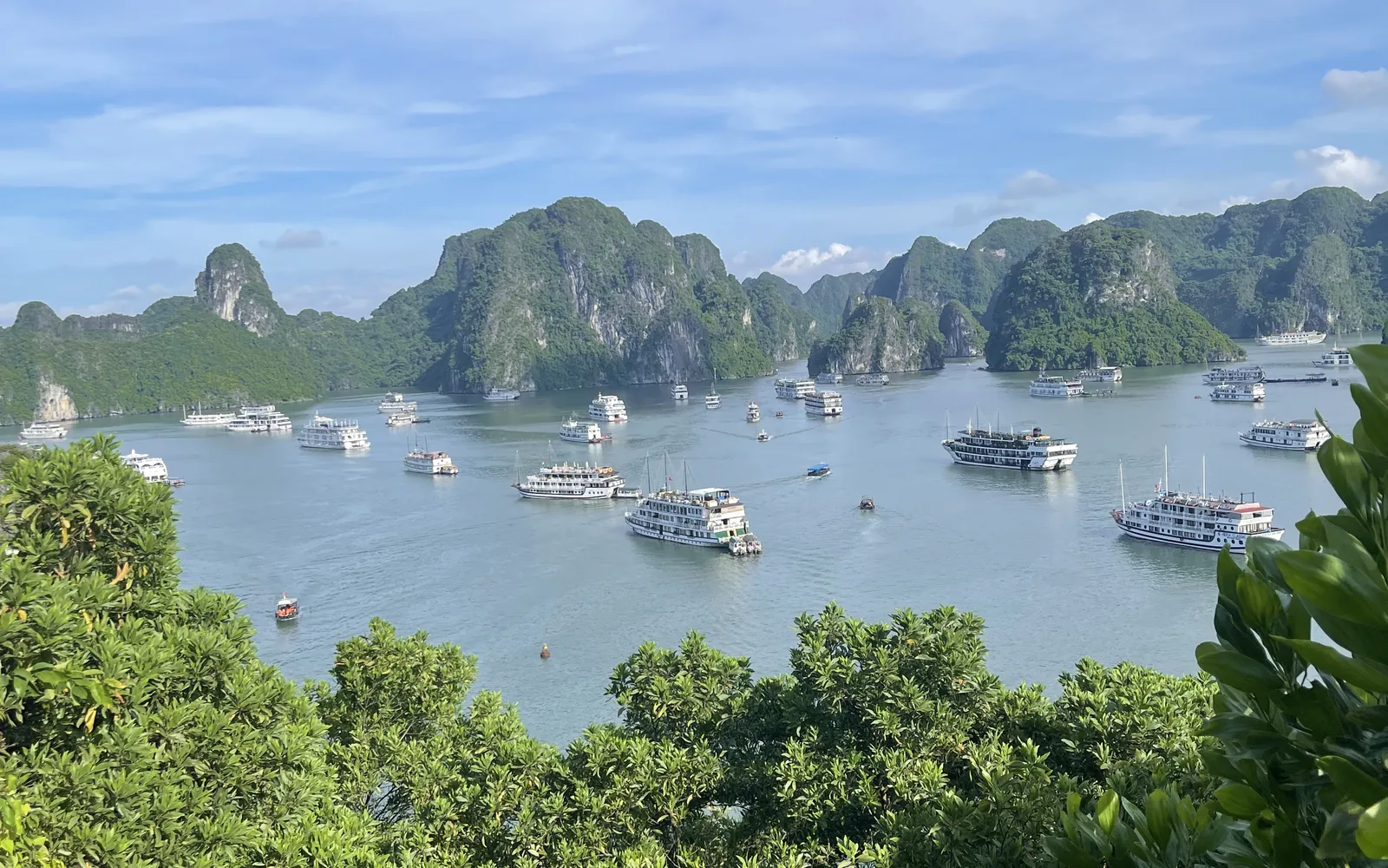 Limestone karst islands and boats on Halong Bay, Vietnam — photo by goFLY founder Mahabub Alam Razu